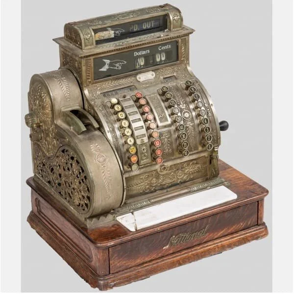 Antique National cash register. Est. $200–400, sold $900