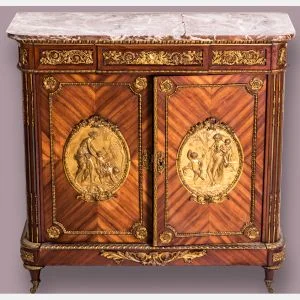 A Louis XVI style tulipwood cabinet with rouge marble top and ormolu mounts by Befort Jeune. Sold $10,000