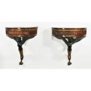 A pair of Italian walnut winged mermaid console tables. Sold $7,500