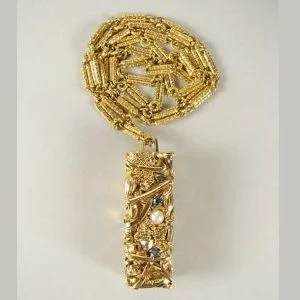 An 18kt gold, diamond and pearl Compression pendant by César Baldaccini (CESAR). Sold $11,000